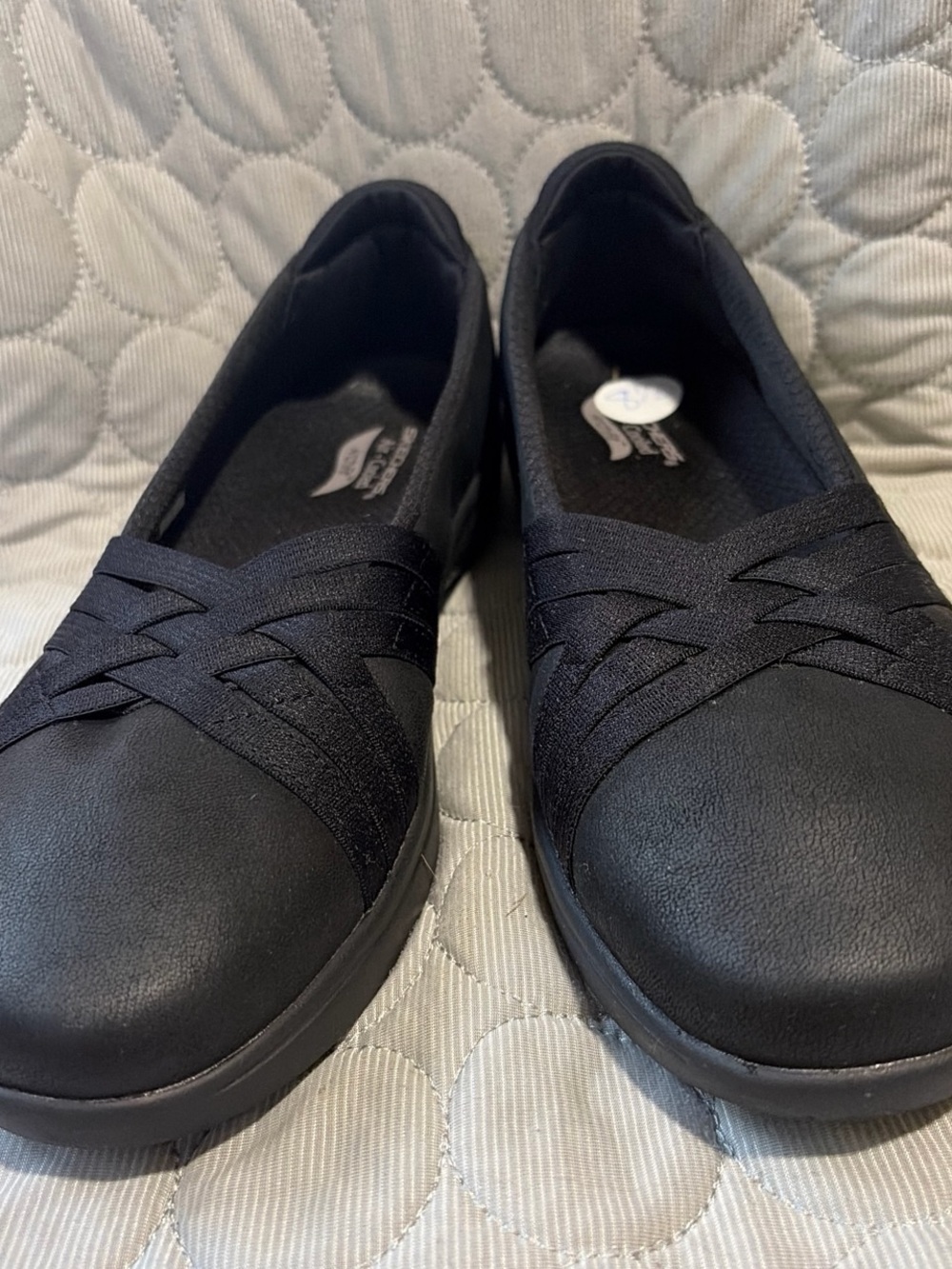 Skechers Women's Black Slip-On Comfort Flats with Crisscross Elastic